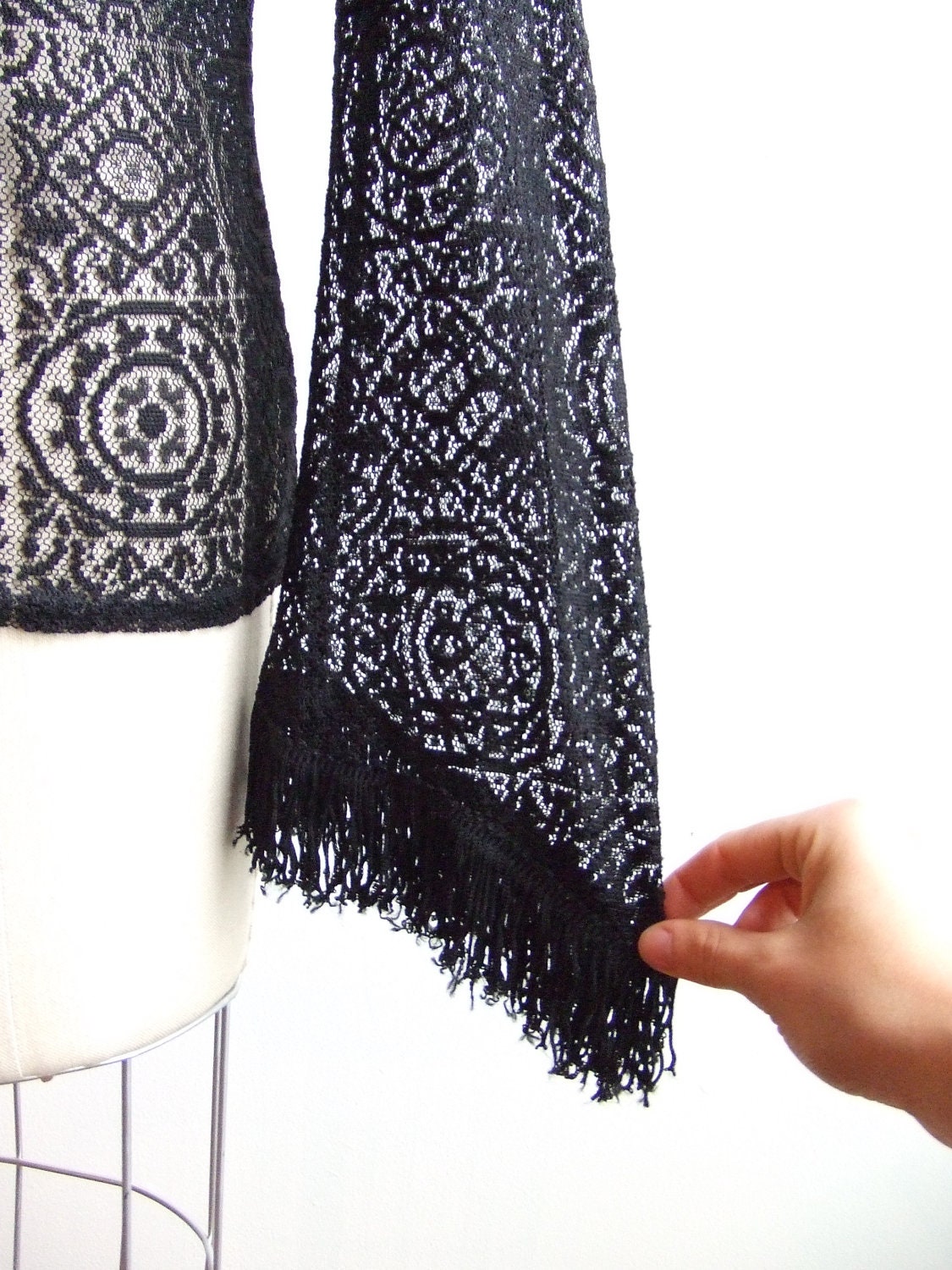 Vintage 1980s designer sheer black lace blouse with fringed detail at cuffs