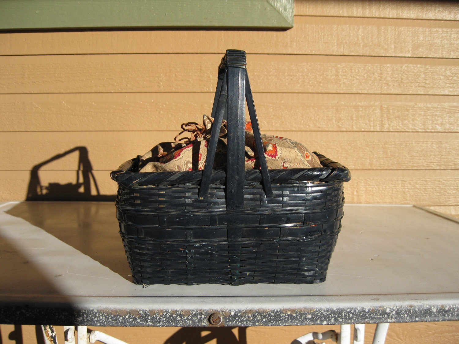 Vintage black wicker sewing basket