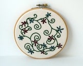 Embroidered red and blue flowers with vines wood embroidery hoop wall art