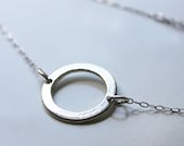 Unity Necklace. Silver Karma Necklace on thin Silver Chain. Circular Charm.