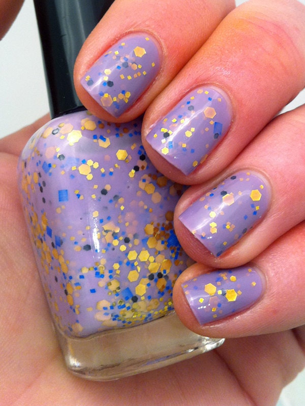 Nail polish - "Regal beginnings" gold, blue and black glitter in a light purple base