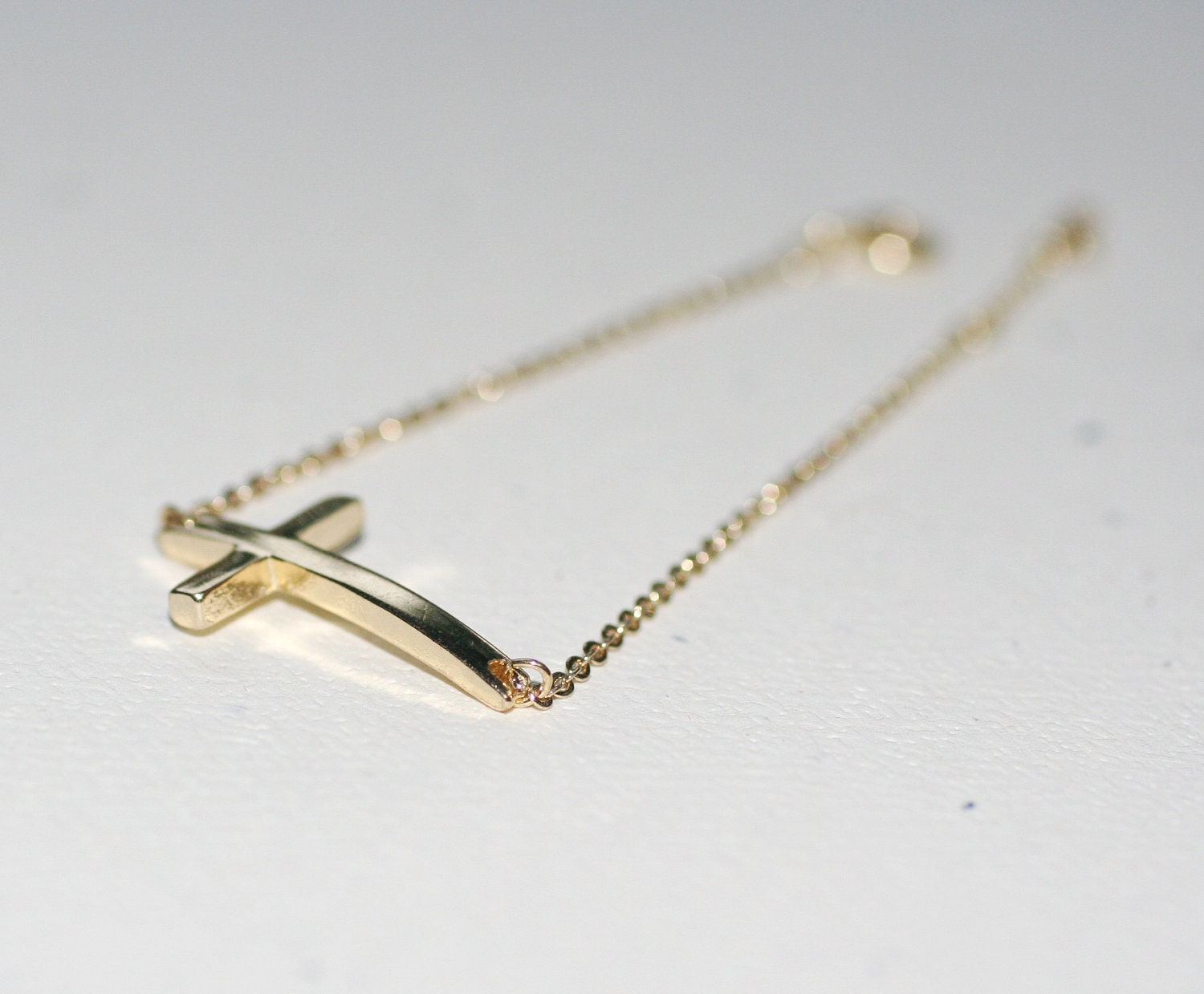 Dainty Gold Sideways Cross Bracelet