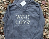 wear Love  put it on. wear it out. large v neck long sleeve pullover hoodie in eco-navy.