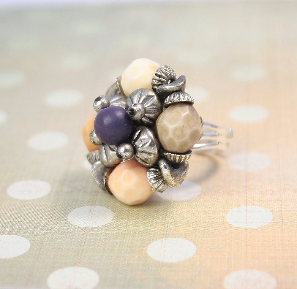 Ring repurposed vintage. Silver tone and adjustable.  Beautiful and one of a kind.
