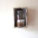 Domestic Time Capsule, 3d wall hanging, assemblage sculpture, mason jar, thread, key, fly