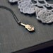 vintage violin necklace.