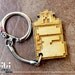 Laser cut and engraved 8bit Goomba Shoe wood keyring