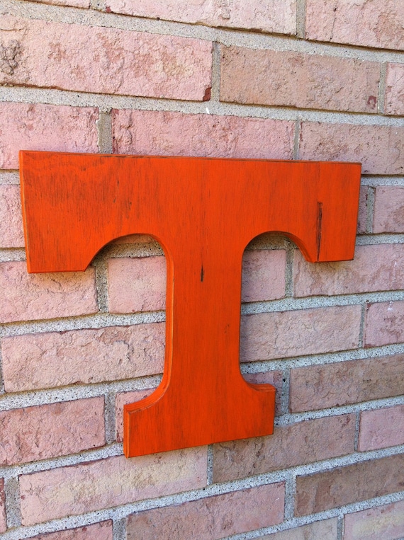 Wooden Tennessee Volunteers Orange T. Large distressed letter. University emblem