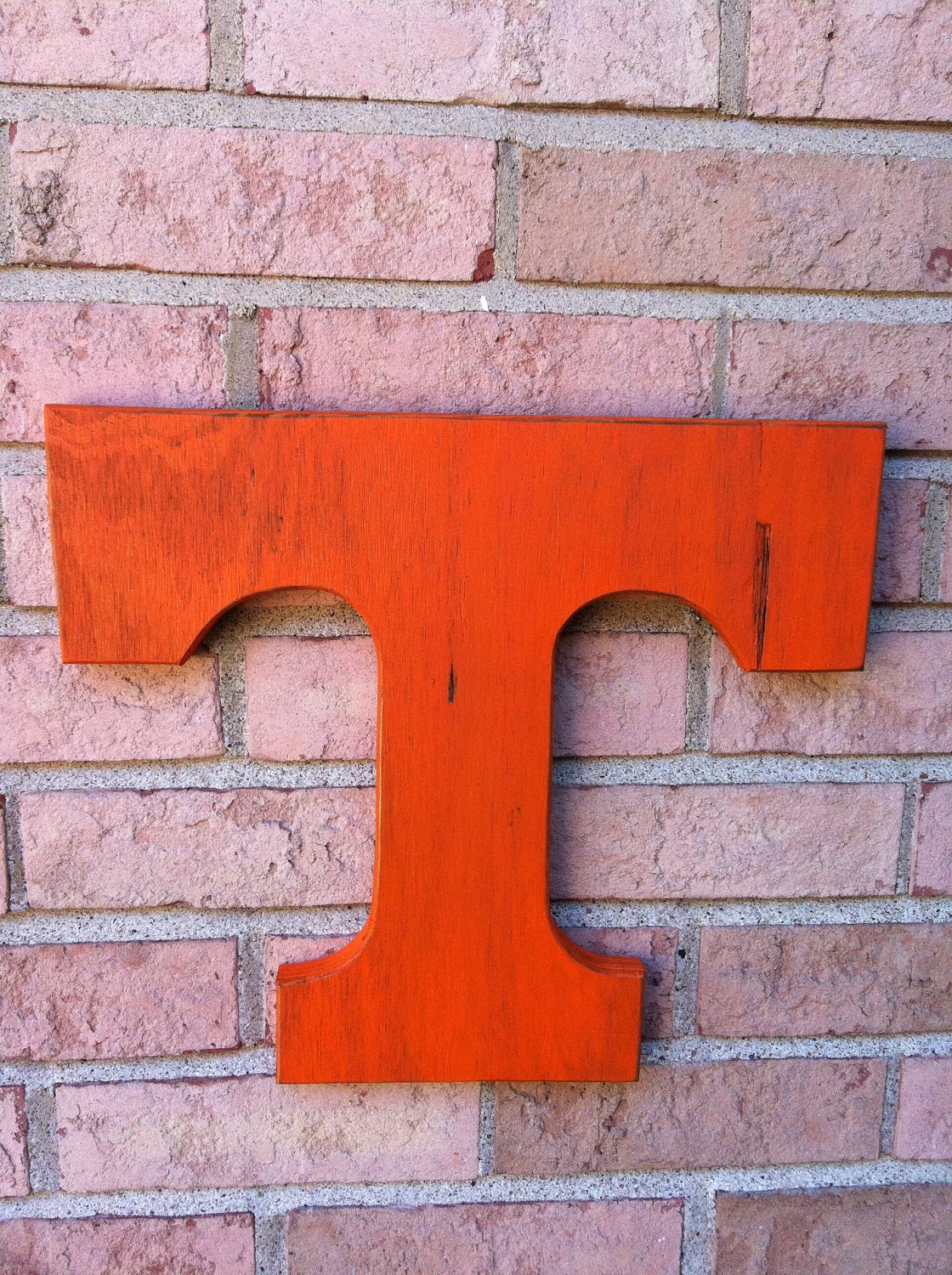 Wooden Tennessee Volunteers Orange T. Large distressed letter. University emblem