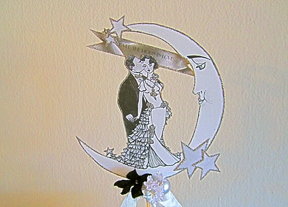 Vintage Inspired Wedding Cake Topper -  1920's Style Bride And Groom Nestled On The Moon in Sparkling Silver Glass Glitter