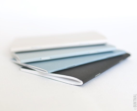 Pastel set of beige, blue and black handmade notebooks (journals)