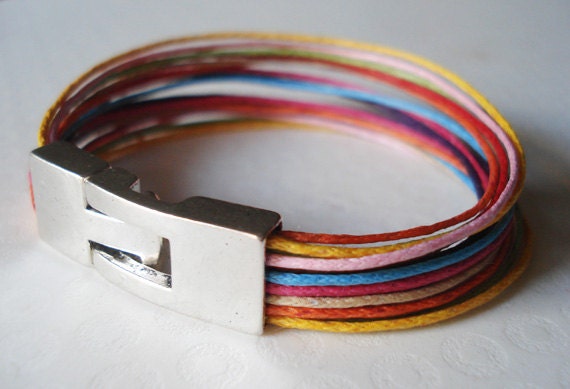 Colorful waxed cotton bracelet. Silver tone clasp. Made to order.
