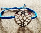 Macramé bracelet - turquoise cord with round silver filigree pattern disc