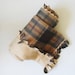 Current Sale- 25% off. Natural Earth Tones FLEECE baby blanket with frayed edges. Plaid design with brown, green, and creams.