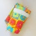 Tied blanket. Girls baby blanket with blue, green, pink, and orange. Bright colored baby blanket.