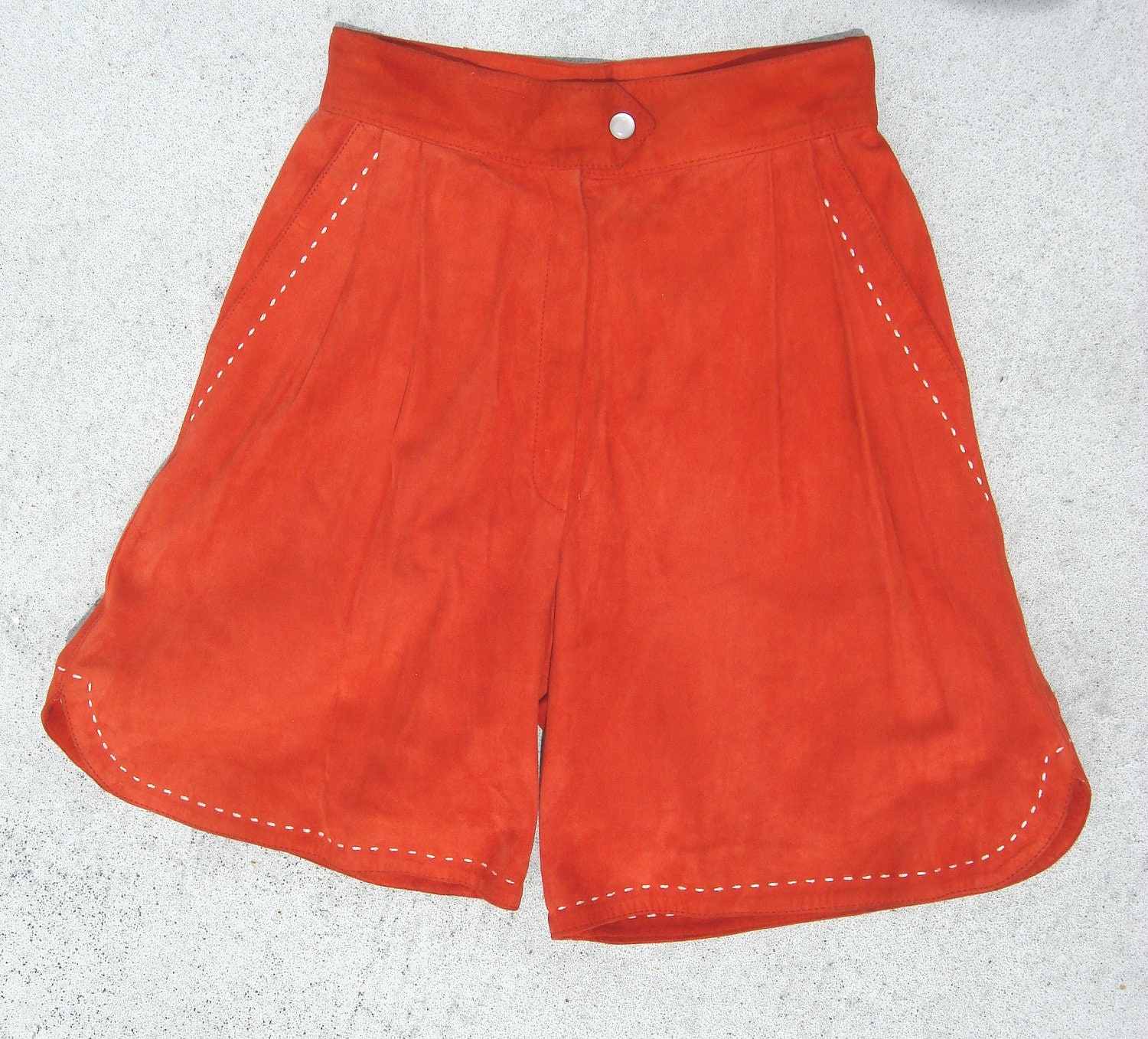 Vintage women Orange suede pair of shorts with white stitching
