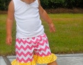 RILEY BLAKE pink CHEVRON ruffle shorts with contrasting yellow polka dot ruffle - girls toddler