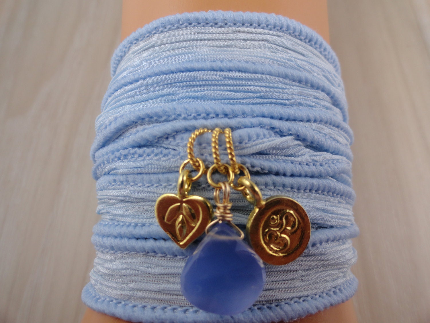 Silk wrap bracelet Karen Hills Tribe gold vermeil Lotus flower,Om charms and periwinkle Chalcedony