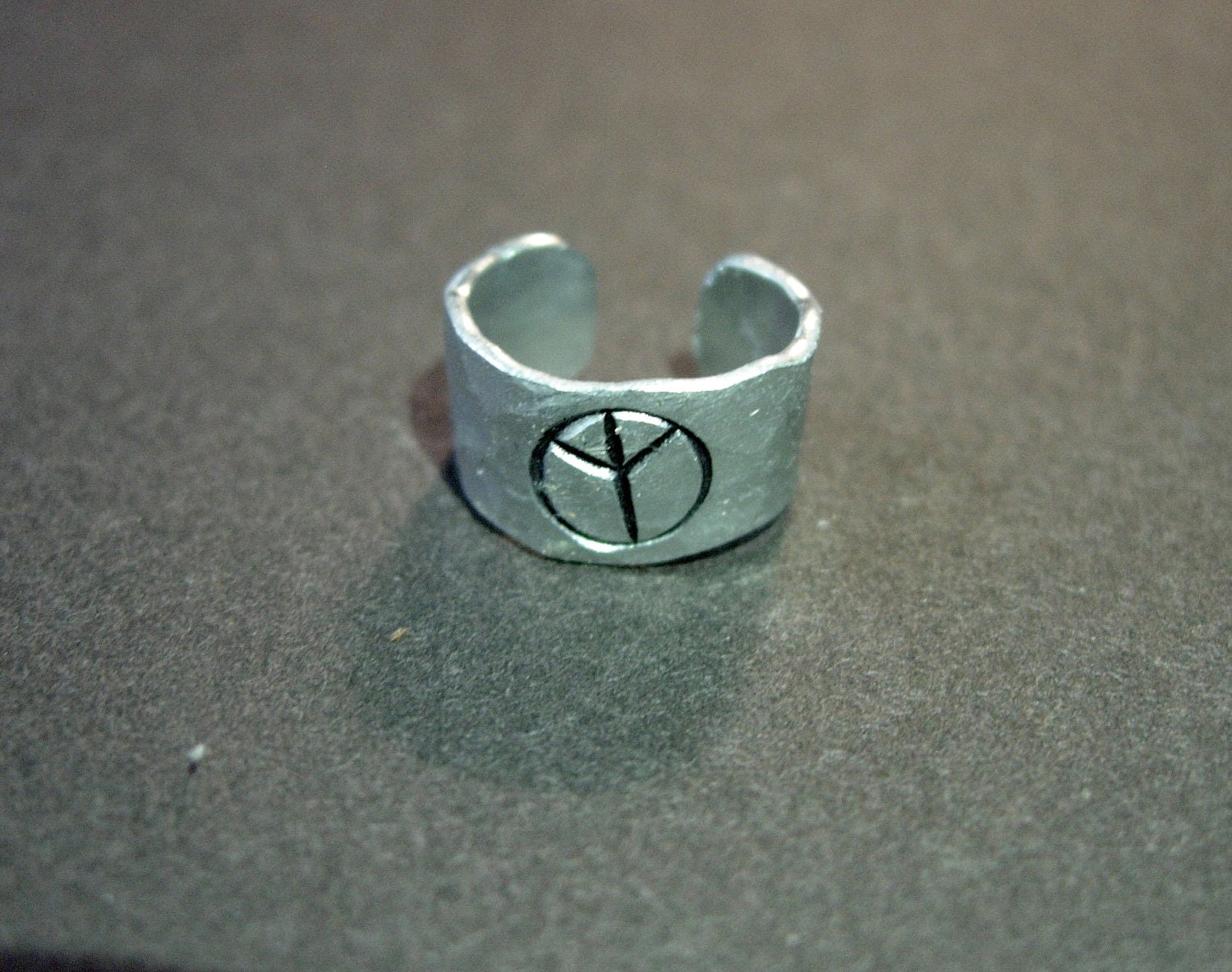 Ear Cuff, Hand Hammered Aluminum with a PEACE sign stamped into the metal and blackened