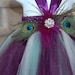 Plum, Ivory & Sage Peacock tutu dress. Plum crocheted top with eggplant/plum  and sage tulle,with broach and peacock feather embellishments.