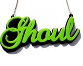 Ghoul Halloween statement word necklace in green and black acrylic