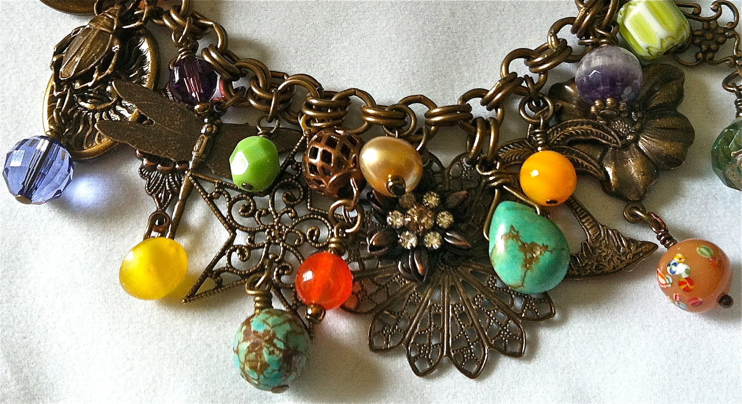 Antiqued brass charm bracelet/necklace with nature theme & vintage beads, crystals, turquoise, trade beads charms, filigree....