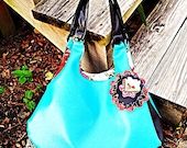 Turquoise Vinyl Handbag with attached Flower