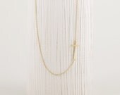 Off Centered Sideways Cross Necklace In Gold