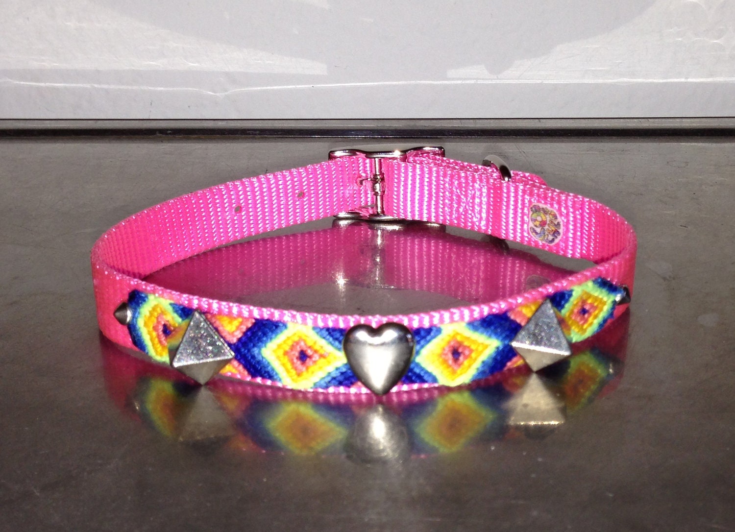 girl dog collar with pyramid studs and heart studs. the chlo chlo collar