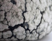 White stoneware sculpture with copper oxide.
