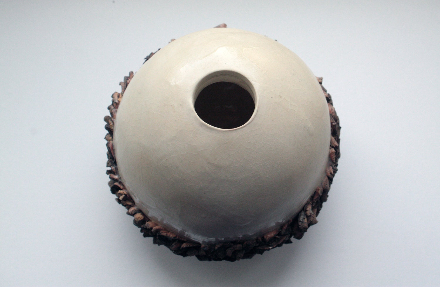 Ceramic sphere vase with white stoneware and red sanded clay.
