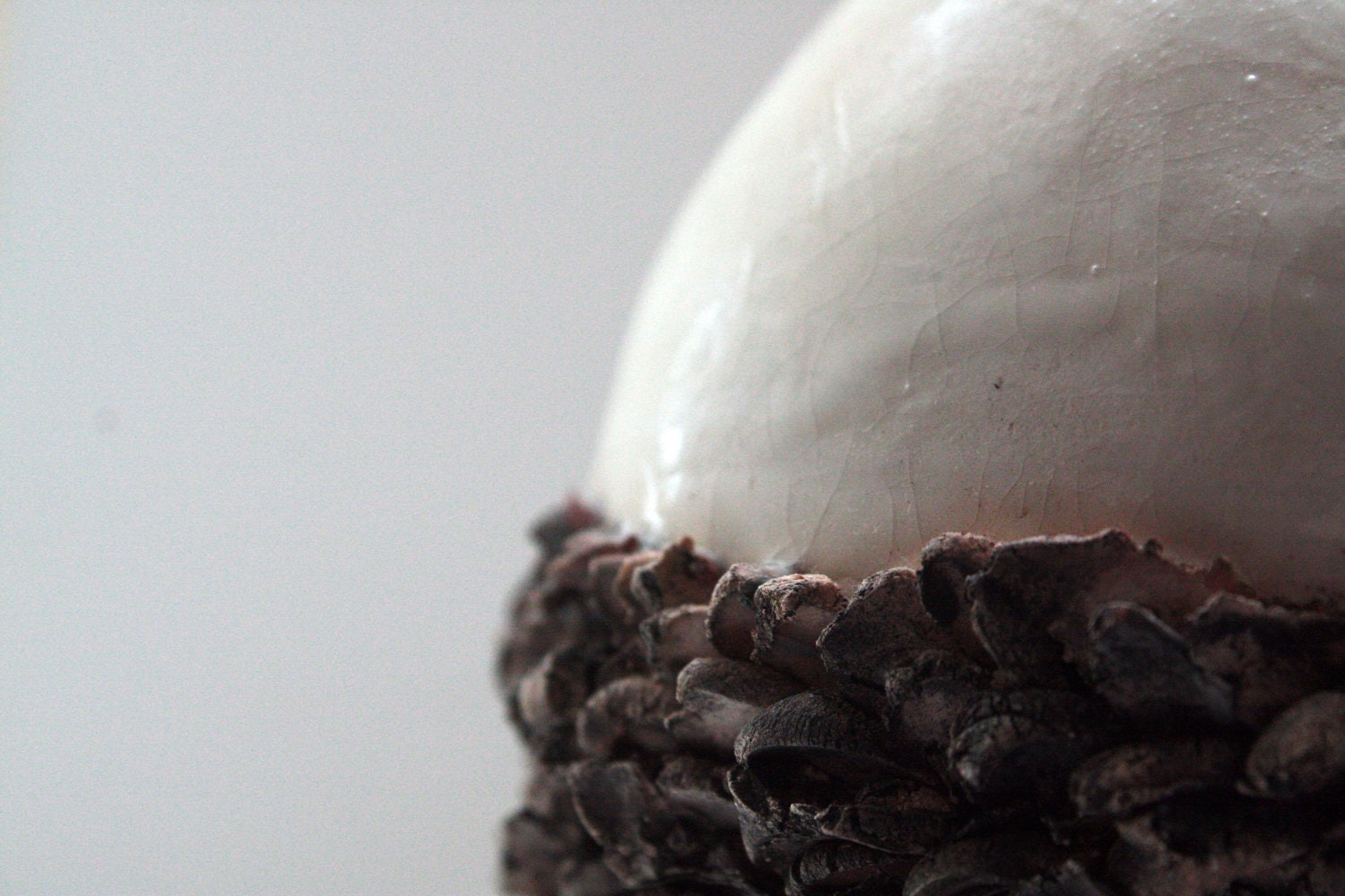Ceramic sphere vase with white stoneware and red sanded clay.