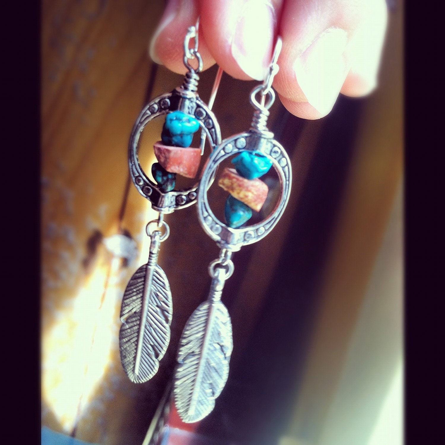 medicine wheel- turquoise and red clay african trade beads captured in a silver design and silver feathers