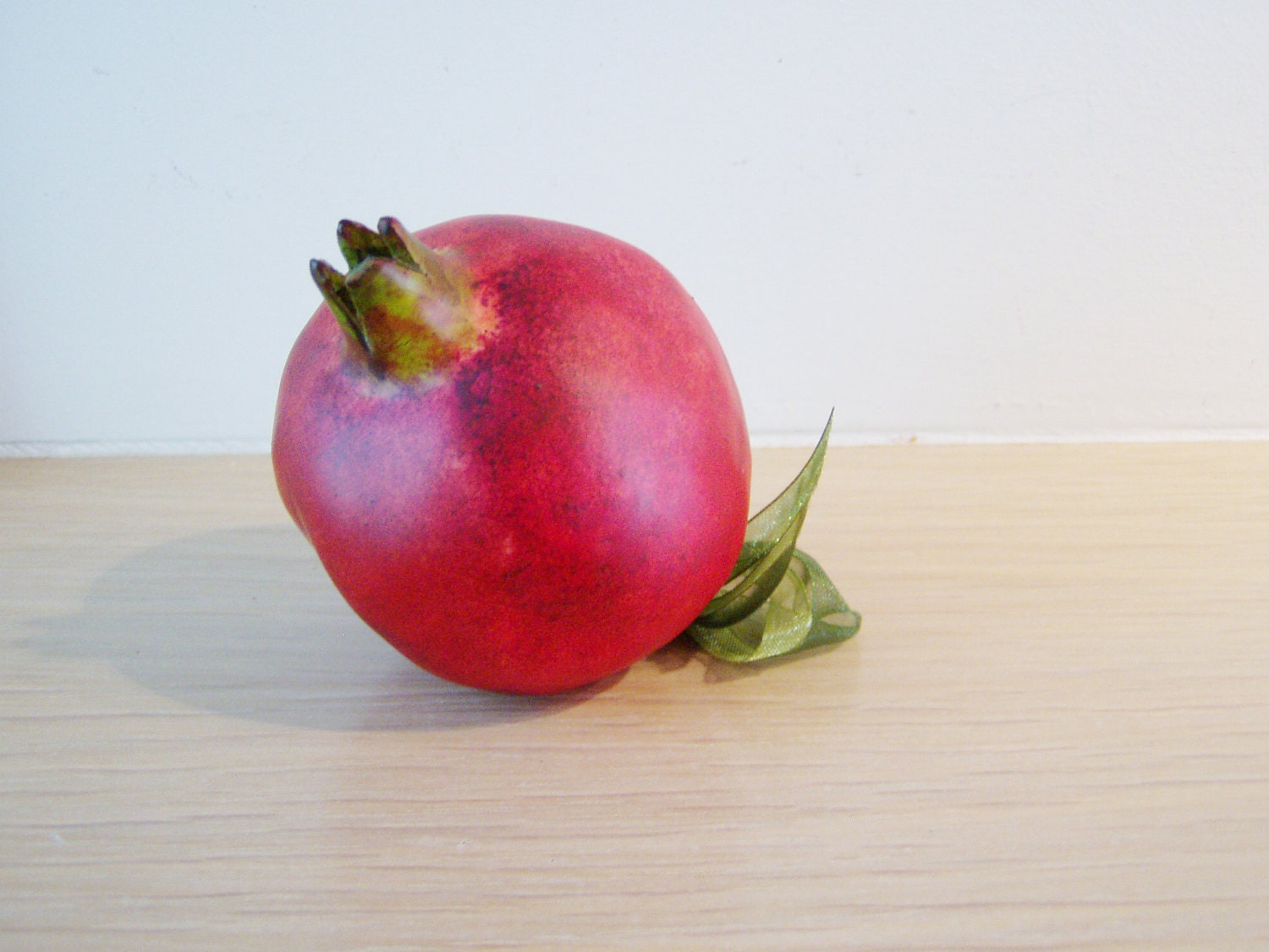 Red ceramic pomegranate with green leaves, made to order