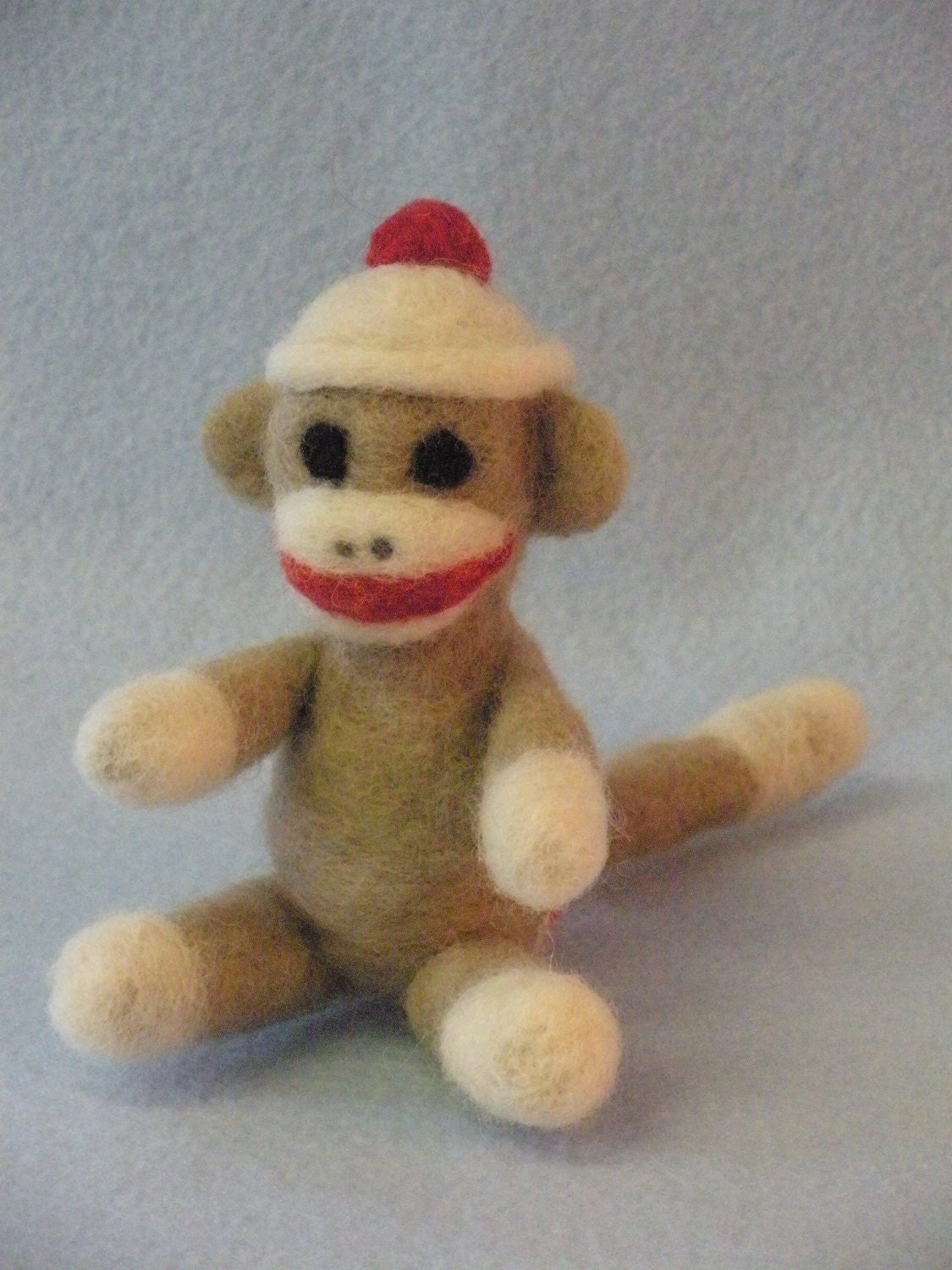 Miniature needle felted 'sock monkey'