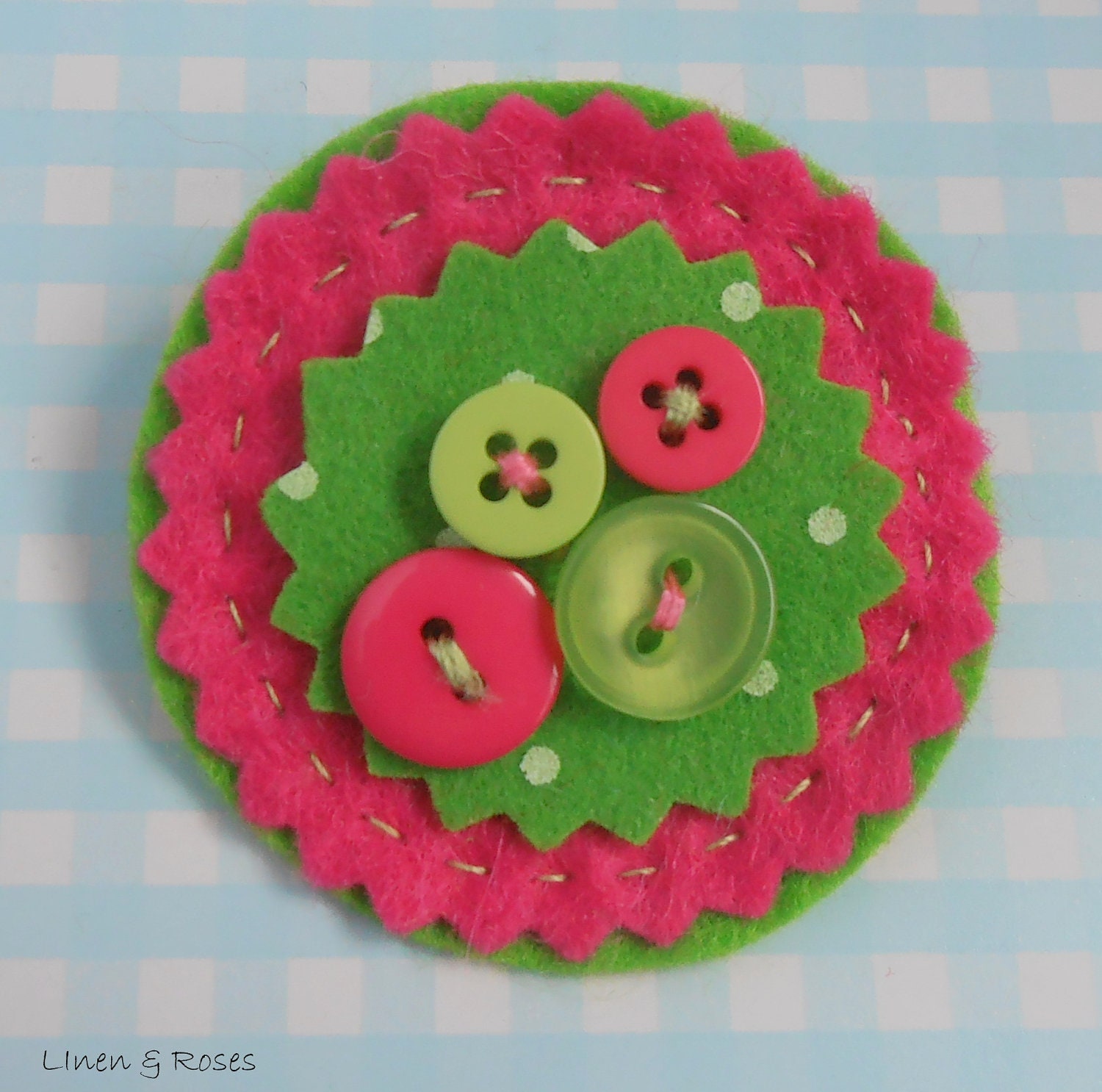 Pretty bright pink and green round felt brooch with button detail