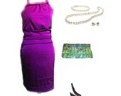 Clutch in Peacock pattern with vibrant purples and greens