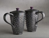 Tall Lidded Spiky Mugs: Two Made To Order Black and Royal Purple Dangerously Spiky Lidded Travel Mugs by Symmetrical Pottery