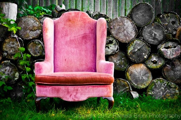 Photography - Wingback chair against Stacked Logs
