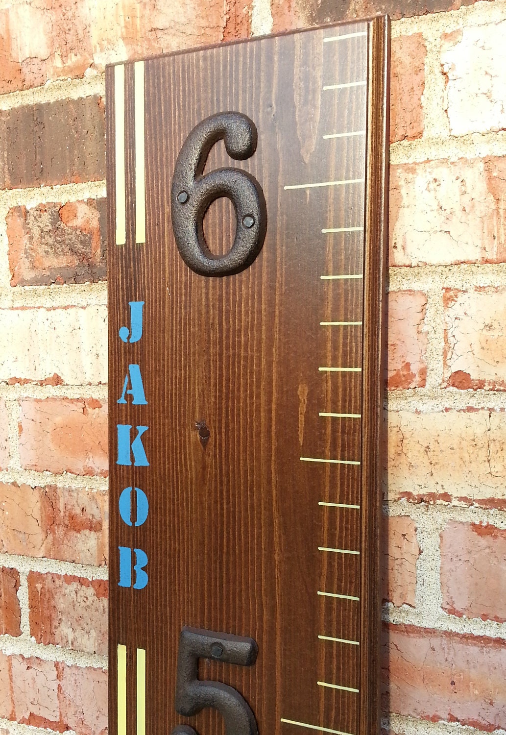 Wooden Growth Chart With A Custom Name And Stripes