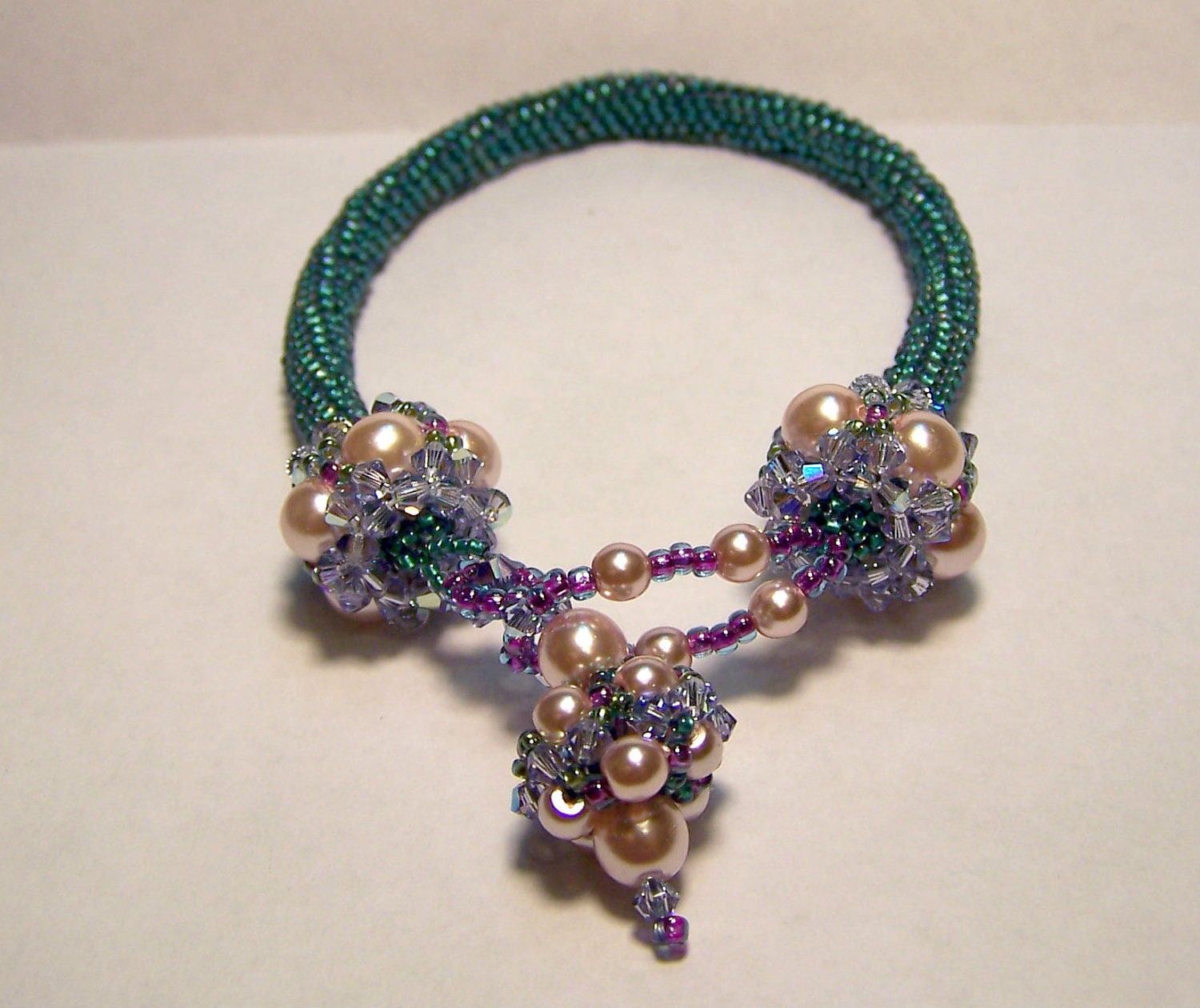 Beadwoven beaded bead dangle bracelet in teals and pinks