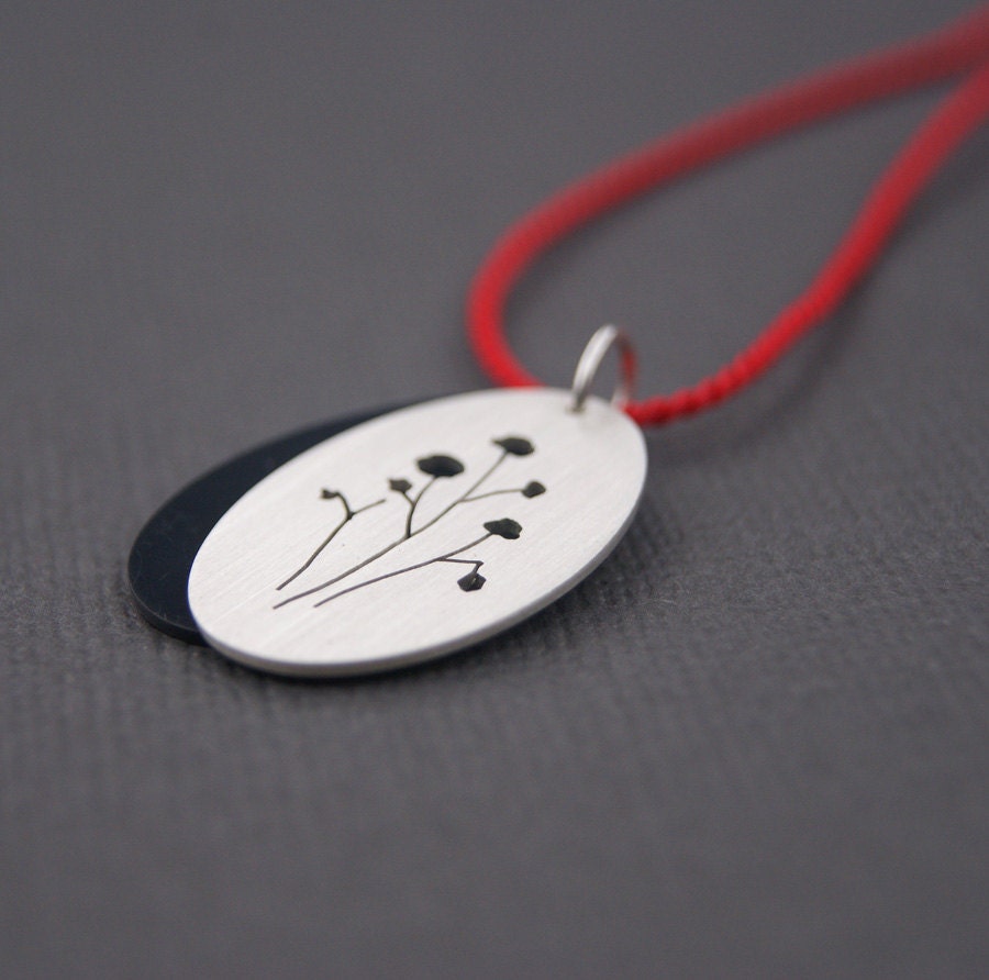 Seed Pods, a layered silhouette pendant