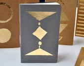 gold diamond and triangles notebook