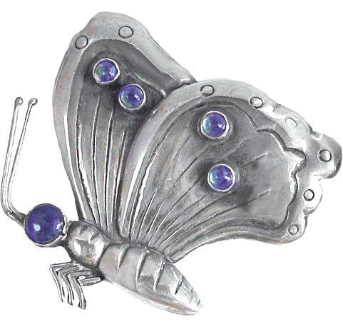 Beautiful silver butterfly, with purple glass beads.
