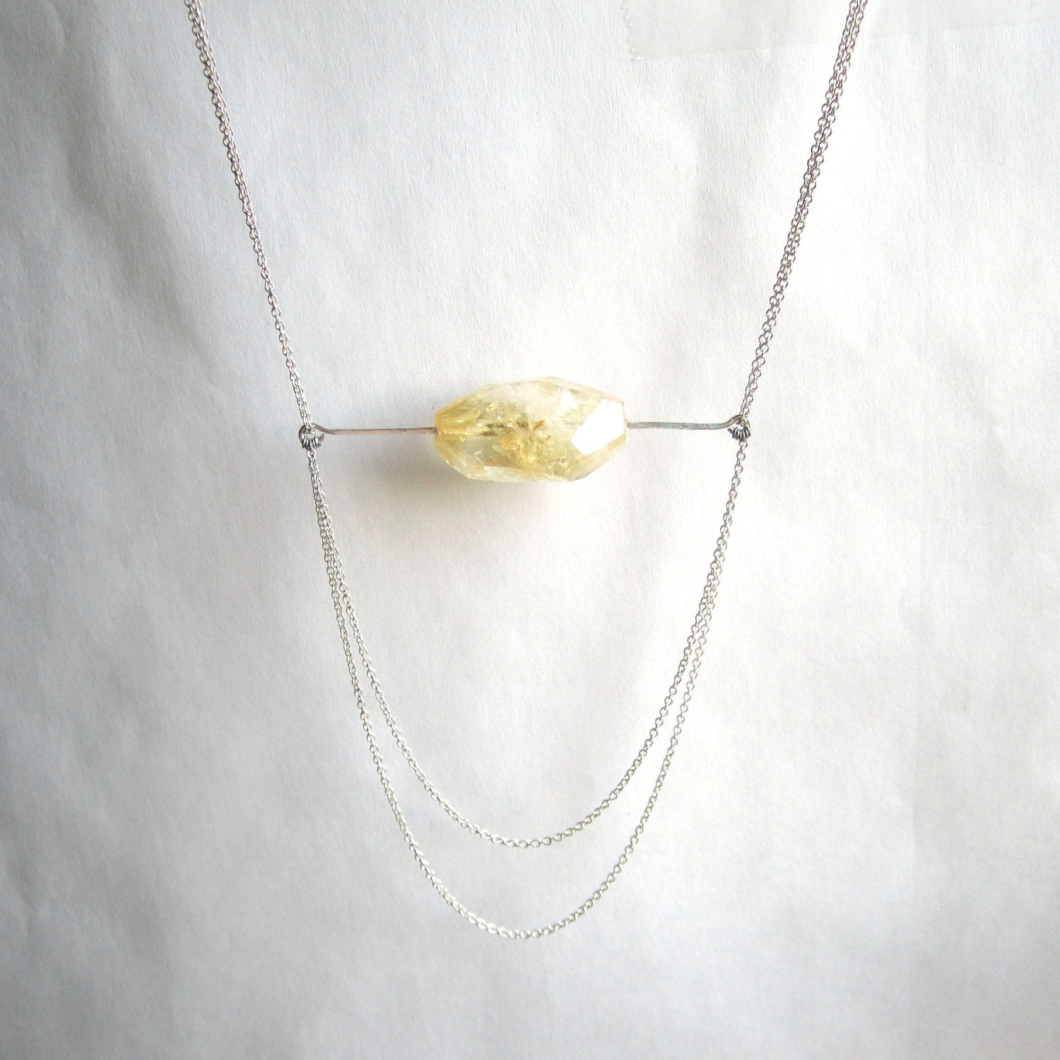 faceted citrine stone with hammered metal and draped chain accent necklace