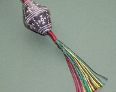 Wristaff - handmade braid with African bead-whorl
