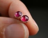 Untreated ruby and rose gold stud earrings