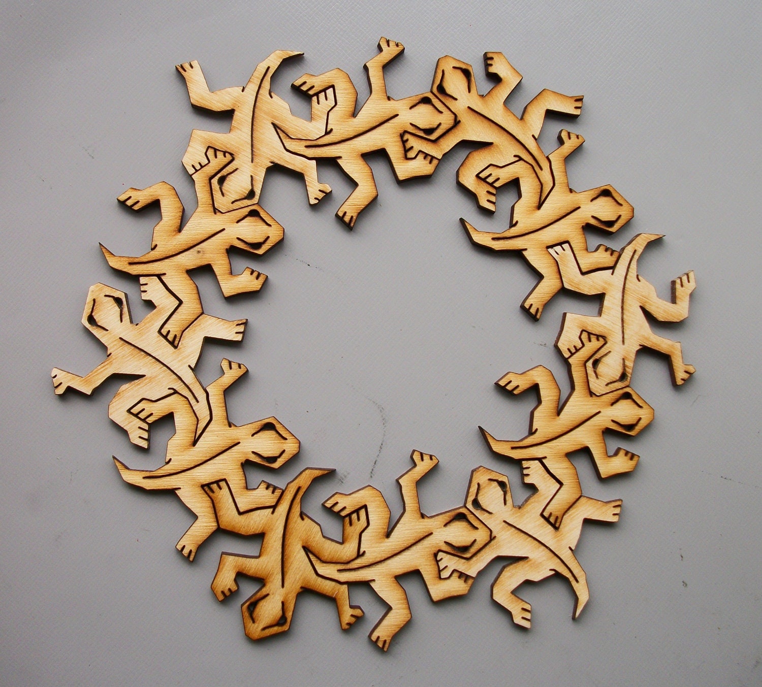 Wooden Tessellating Lizards like Escher. Fully interlocking. One dozen.