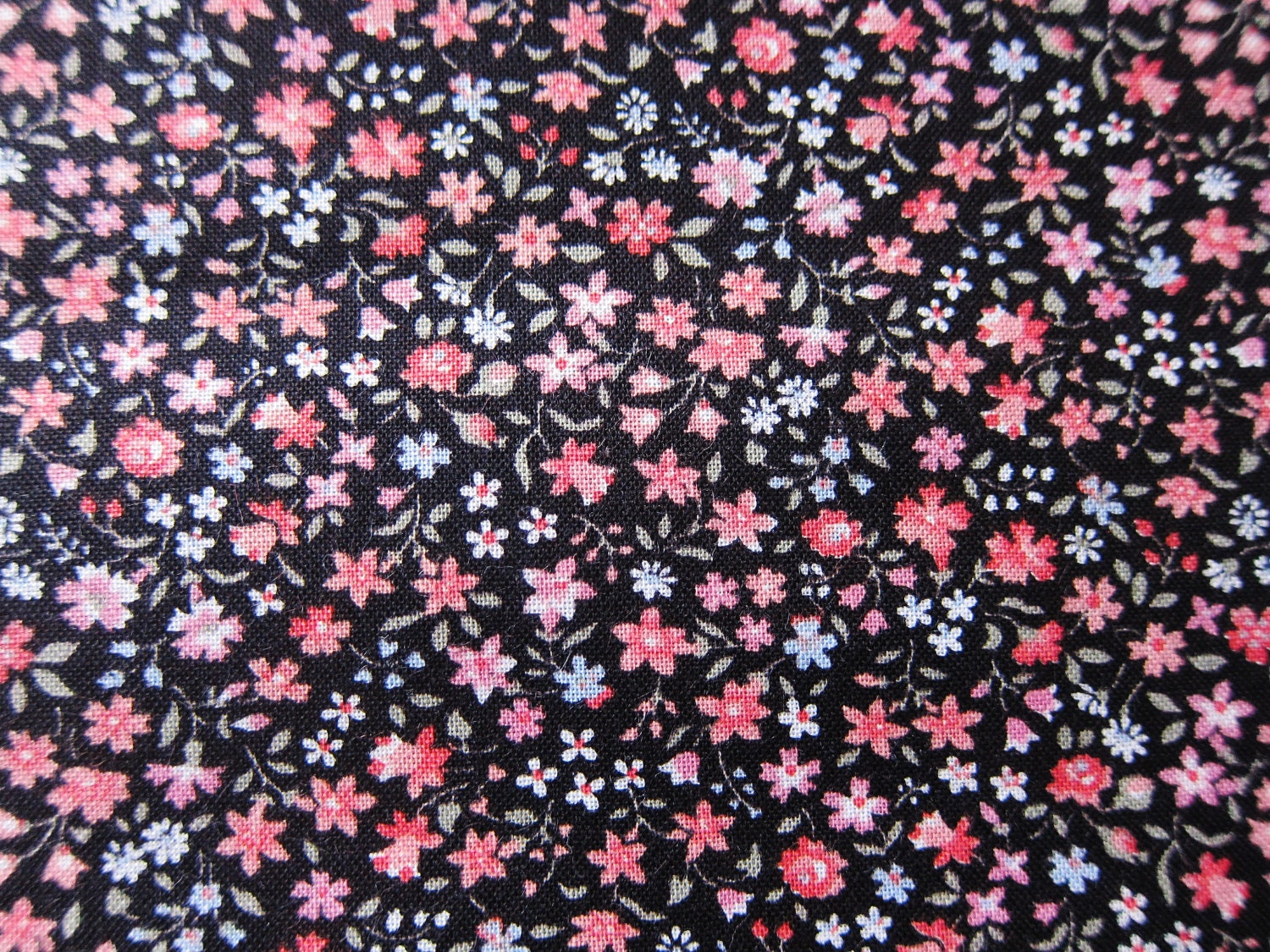 Quilting cotton black ground tiny floral remnant