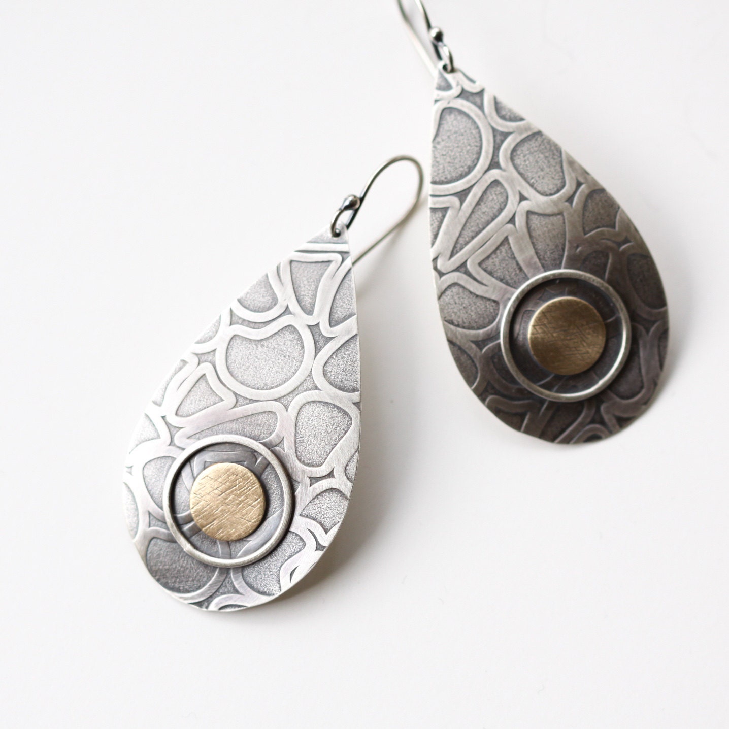 Sleek sterling silver earrings, large teardrop shape with a unique texture and embellished with framed brass circle - "Mosaic Earrings"